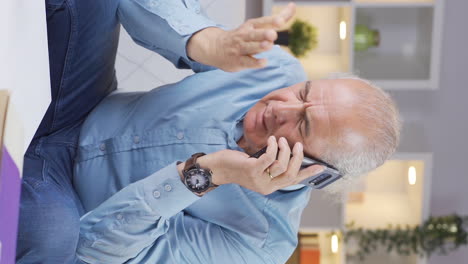 Vertical-video-of-The-old-man-having-a-separation-argument-on-the-phone.